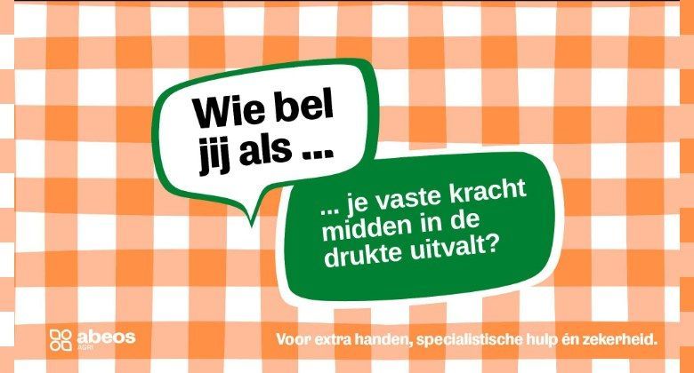 Wie bel jij als je vaste kracht midden in de drukte uitvalt? Campagnebeeld met oranje tafelkleed en groene tekstballonnen.